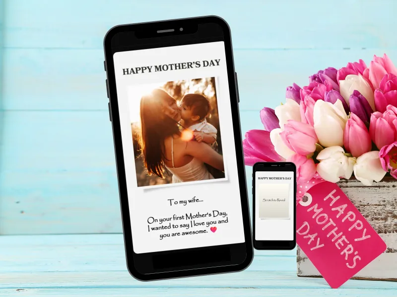 Mother's Day photo reveal scratch card on a phone, with a mother and baby photo beside pink tulips